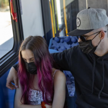 Human Trafficking Example of a young girl and a contorlling older male riding the bus.